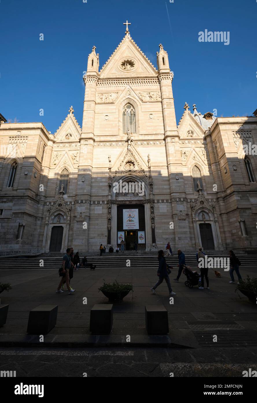 The white marble facade of the Duomo, Cattedrale di Santa Maria Assunta, Catholic church landmark in the Centro Historico neighborhood. In Naples, Nap Stock Photo