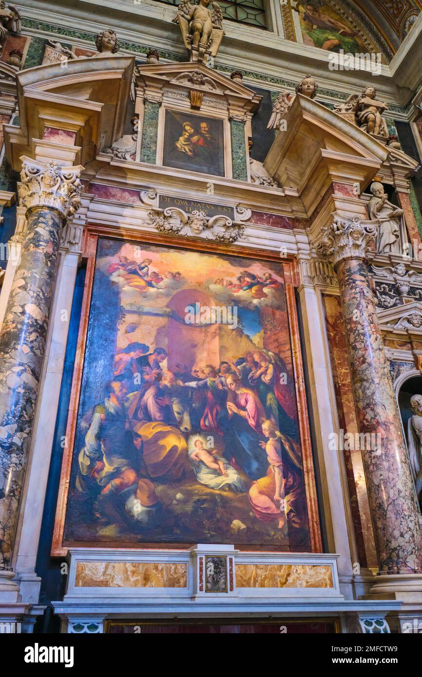 One of several large oil paintings of religious scenes mounted throughout the church. This painting celebrates the birth of Jesus Christ. At the Chies Stock Photo