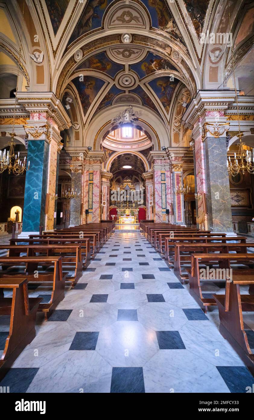 Interior view of the central nave, aisle with wood pews. At the Church of Saints Domenico Soriano and Nunzio Sulprizio. In Naples, Napoli, Italy, Ital Stock Photo