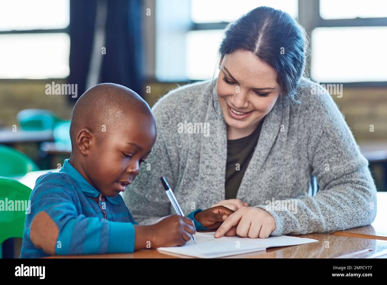 There is so much joy in being a teacher. an elementary school boy and