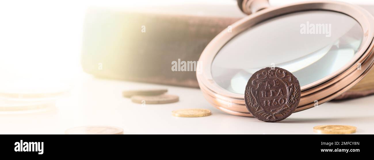 Numismatics. Old collectible coins on the table Stock Photo - Alamy