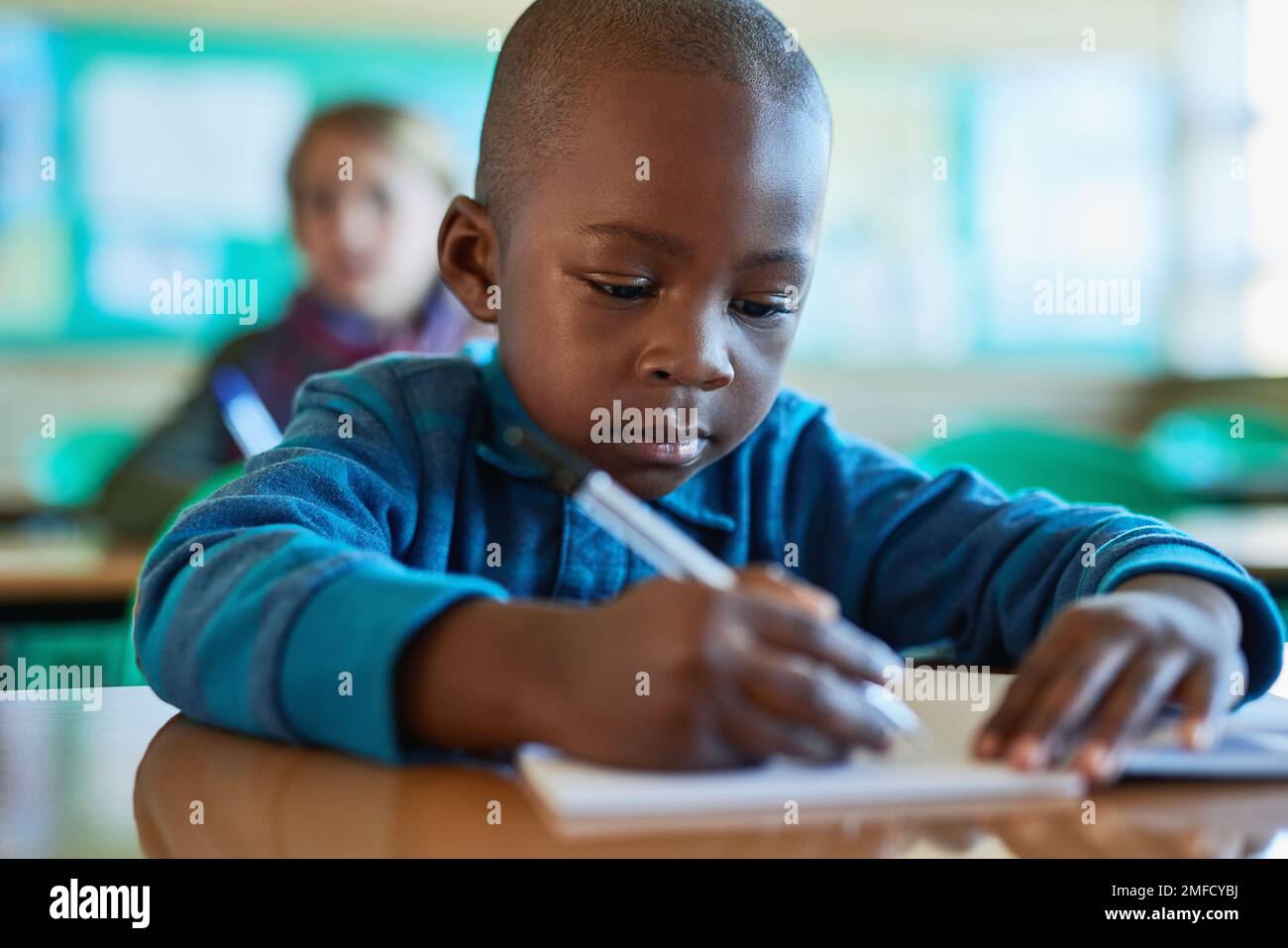 Little minds with great thoughts. an elementary school boy working in class. Stock Photo