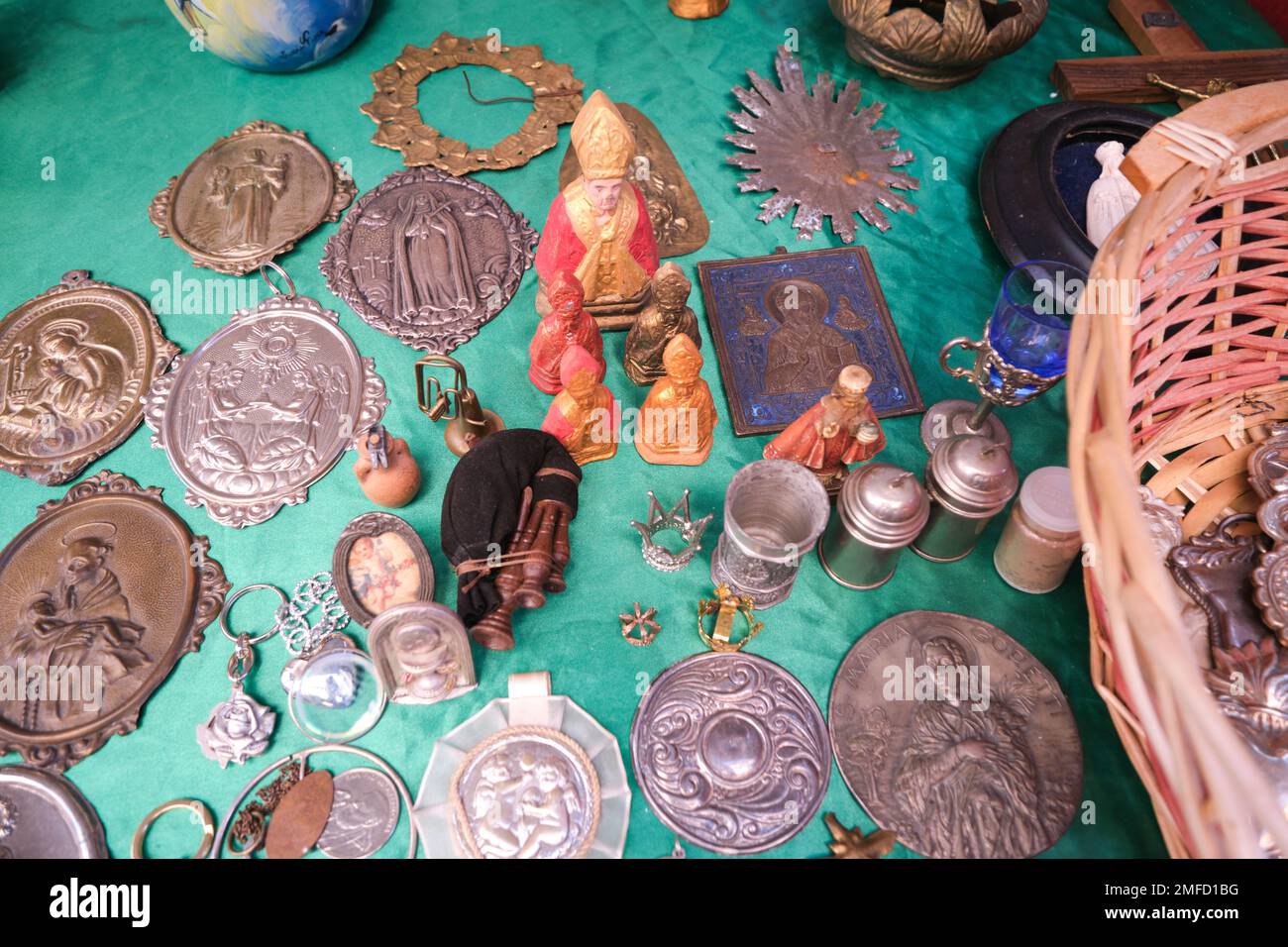 Old collectibles, Catholic relics, icons for sale at a street vendor in the Centro Historico neighborhood. In Naples, Napoli, Italy, Italia. Stock Photo