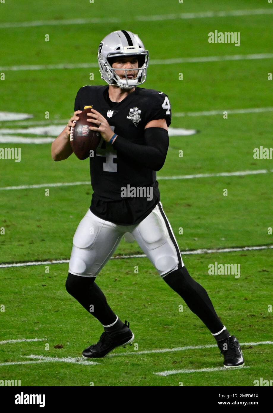 Las Vegas Raiders quarterback Derek Carr (4) looks to throw against the