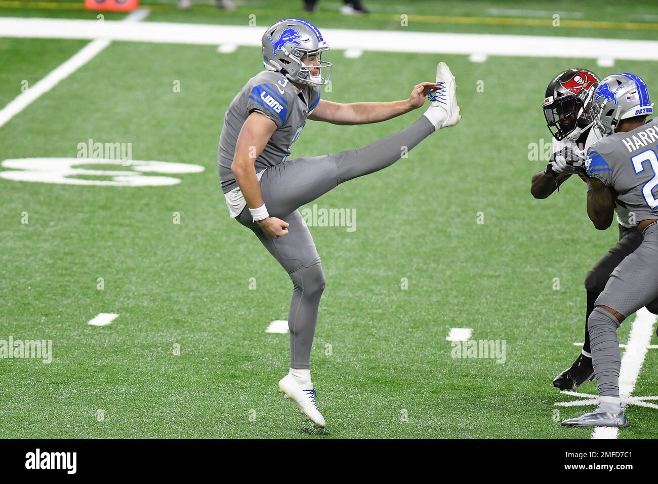 Detroit Lions punter Jack Fox kicks during the first half of an NFL