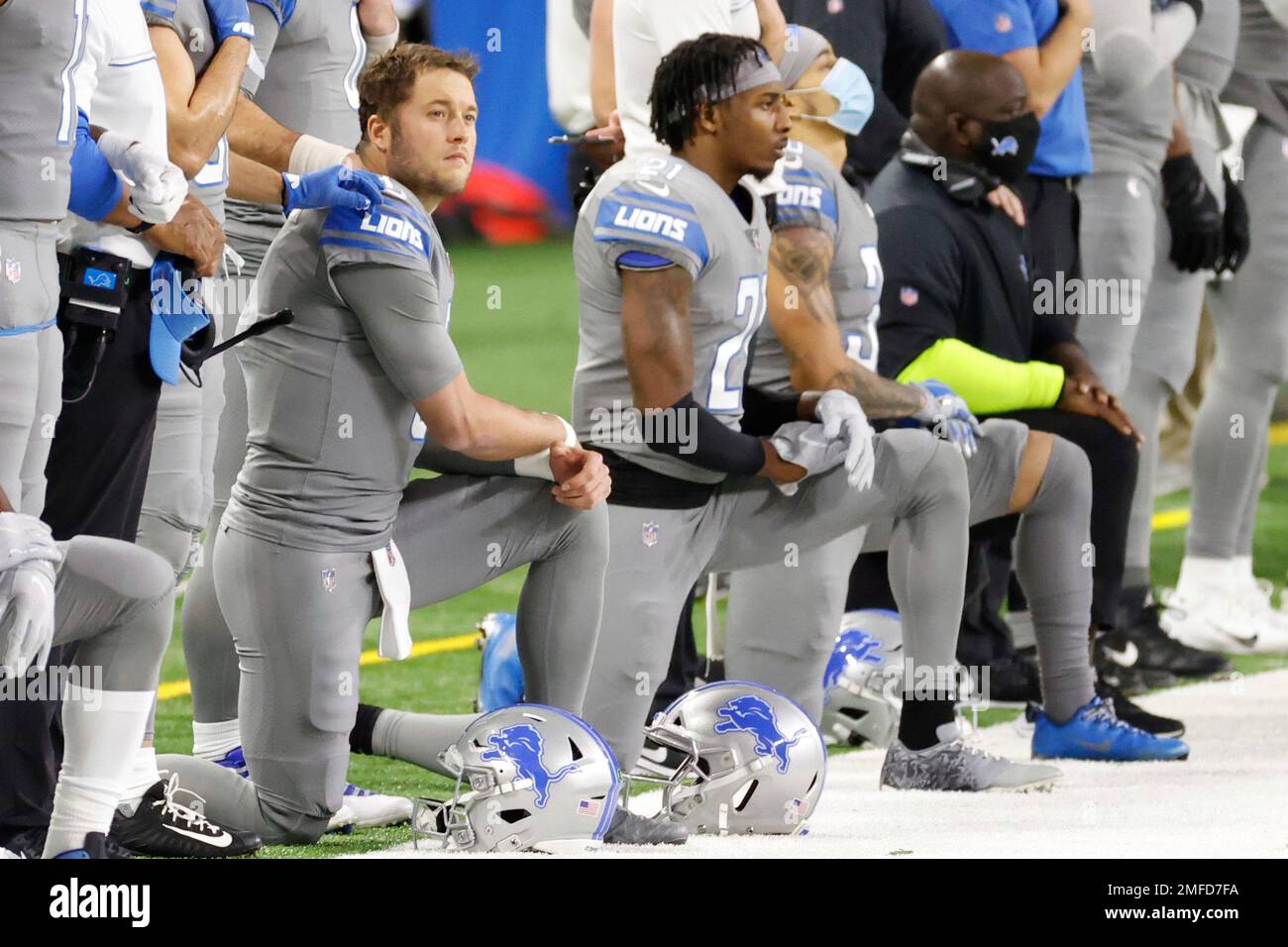 Detroit Lions quarterback Matthew Stafford (9) and defensive back Tracy