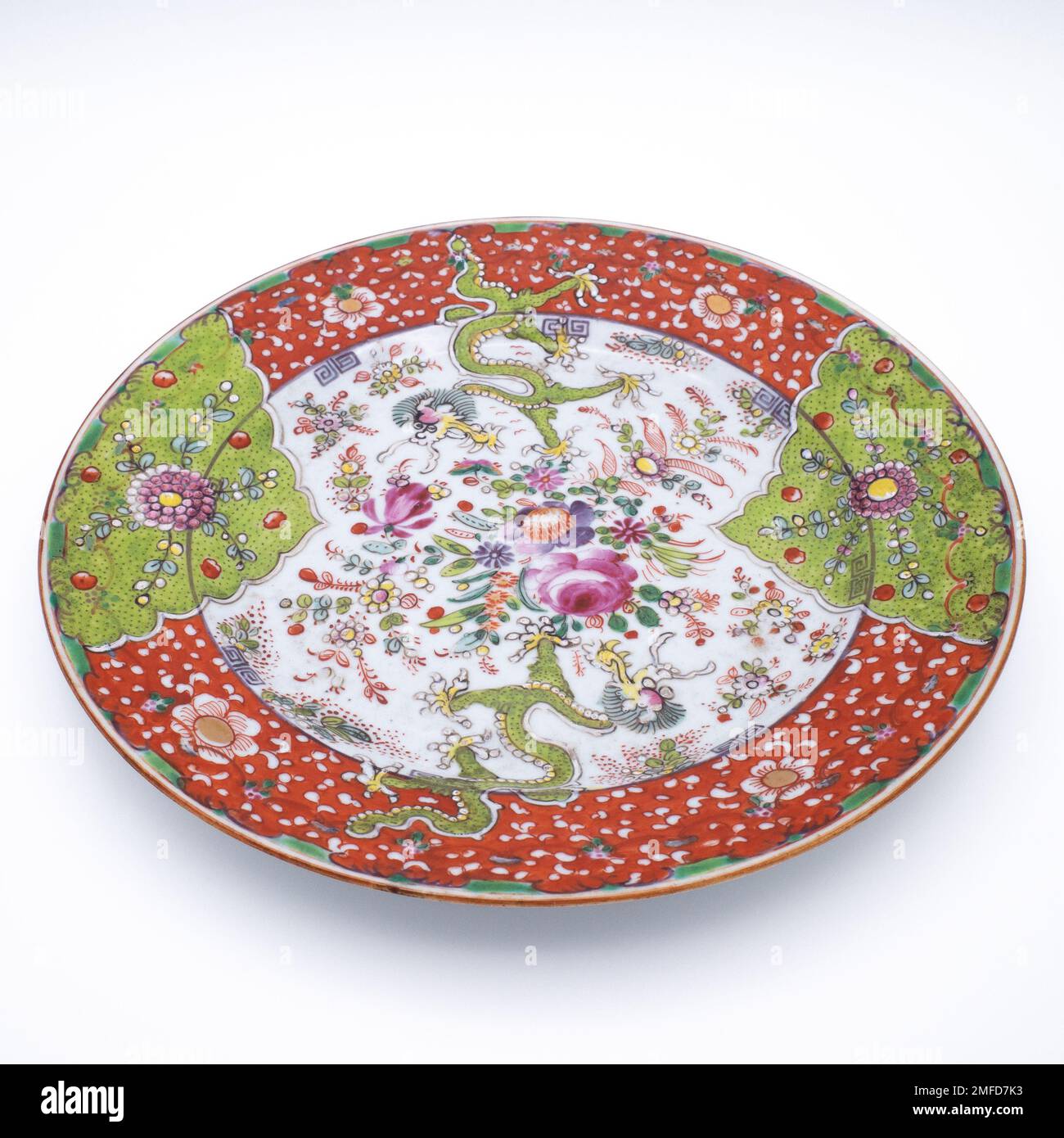 Antique Chinese Clobbered Famille Rose Porcelain Dish With Dragons. 18th-19th century Stock Photo