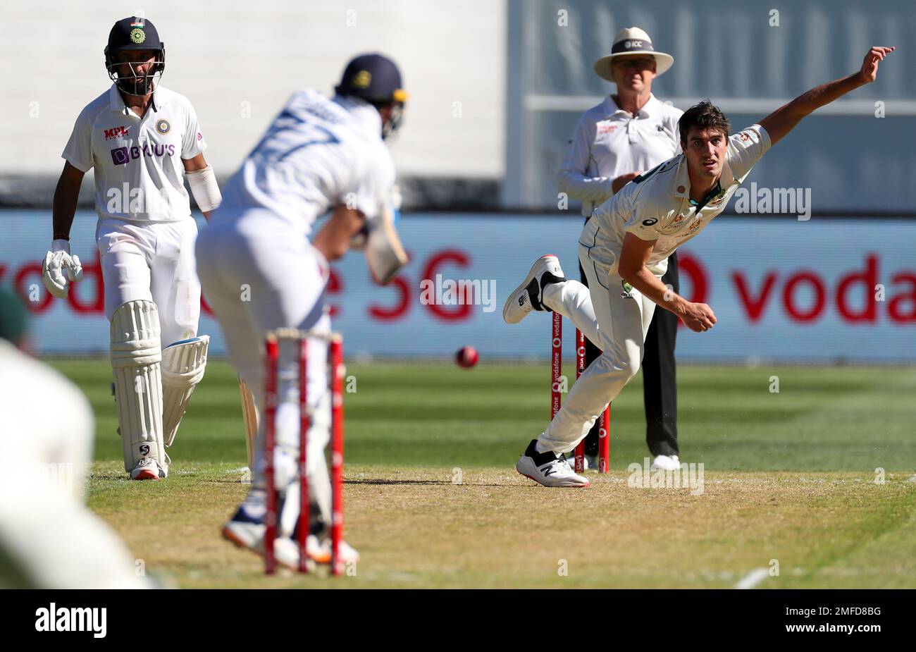 Australia's Pat Cummins bowls to India's Shubman Gill during play on day one of the Boxing Day