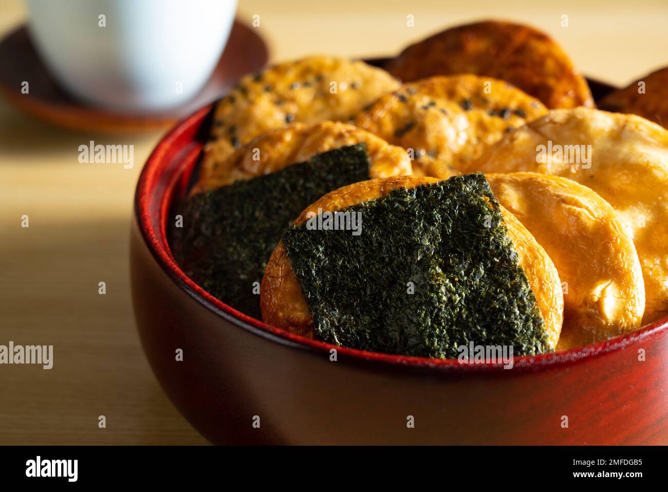 Sembei and green tea on the table. Sembei is a Japanese snack. Japanese image photo. Stock Photo