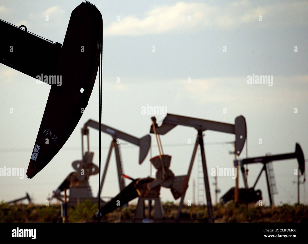 FILE In this April 24, 2015, file photo, pumpjacks work in a field
