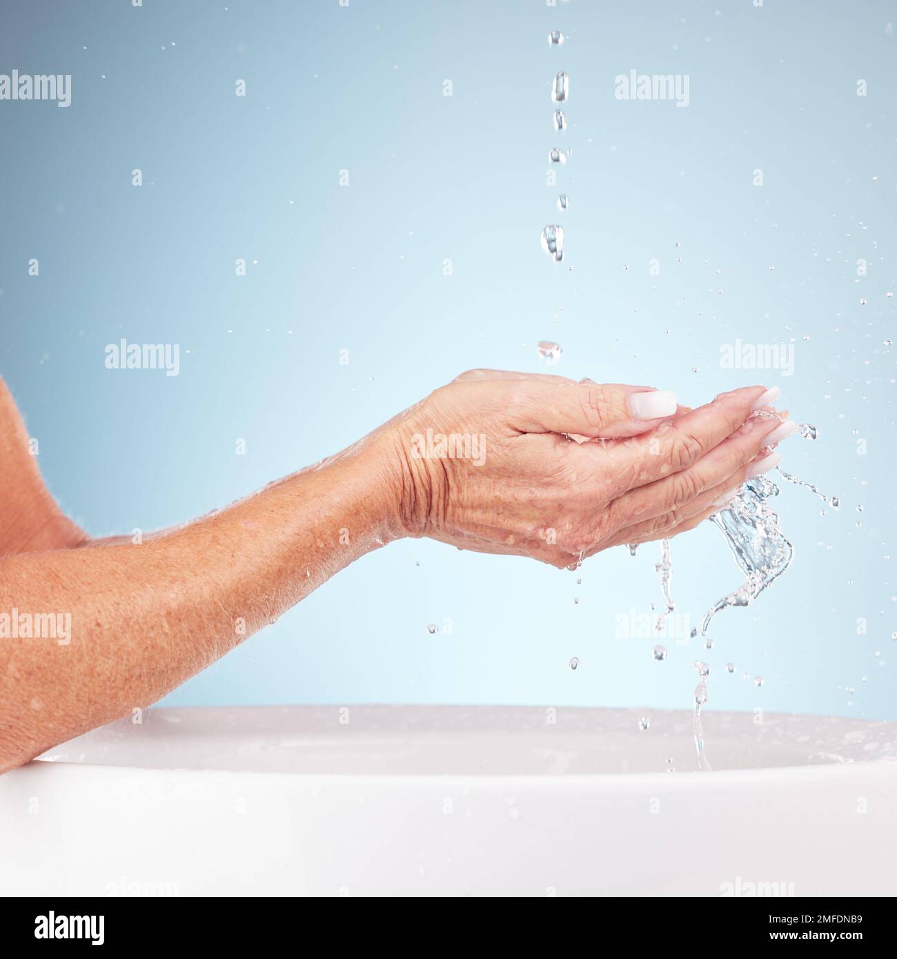 Senior hands, water and wash for clean hygiene, fresh minerals or