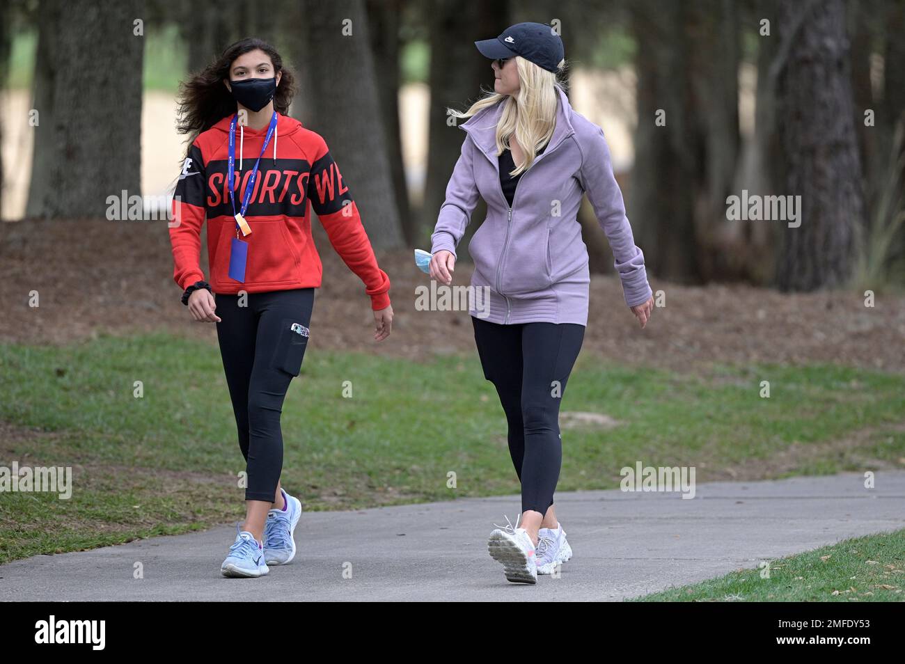 Elin Nordegren, right, and her daughter Sam Alexis Woods follow Tiger Woods and Charlie Woods on
