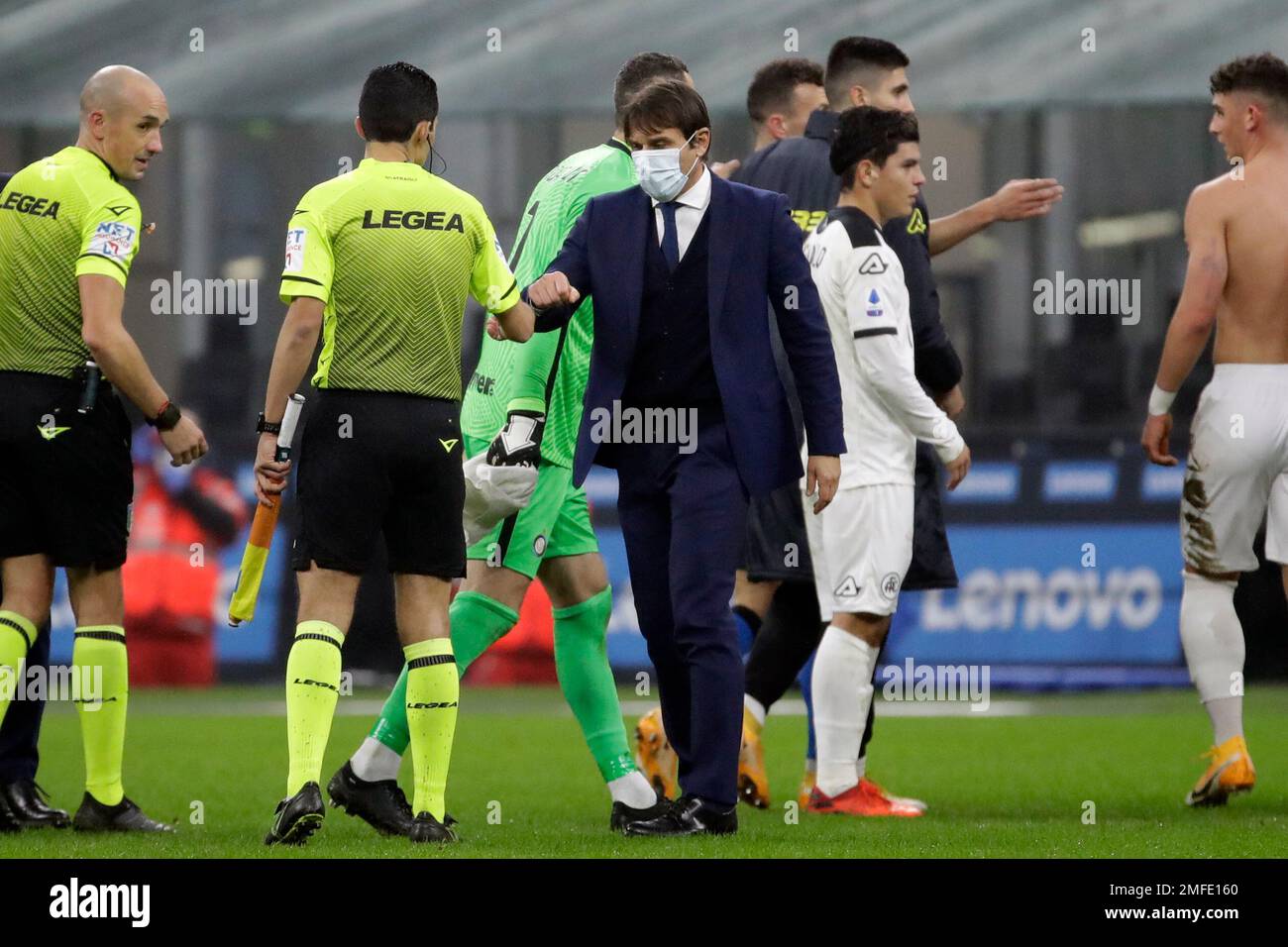 Inter Milan's head coach Antonio Conte greets a linesman at the end of