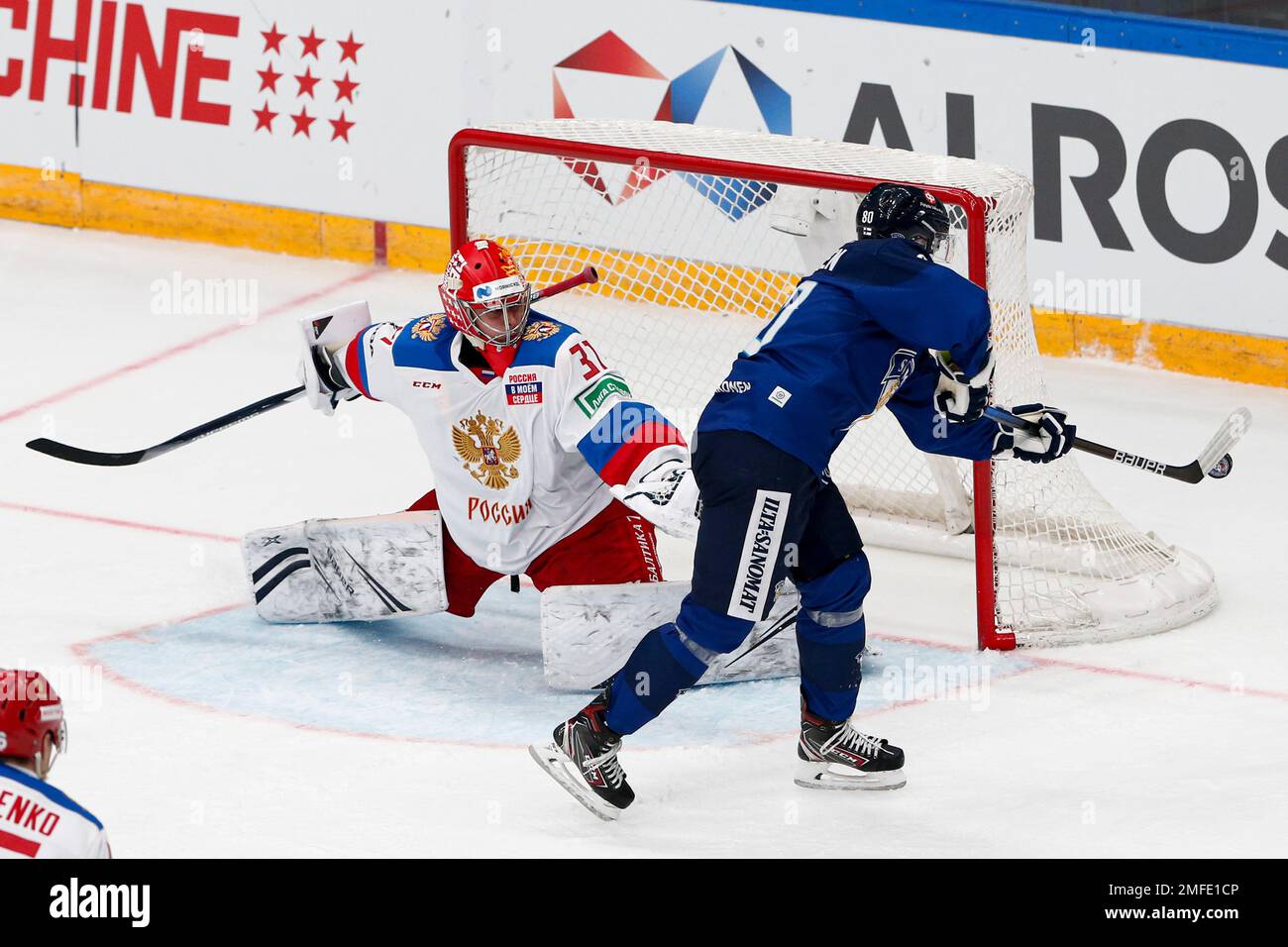 Finlands Teemu Turunen, right, tries to score against Russias goalie Alexander Samonov during the Channel One Cup ice hockey match between Russia and Finland in Moscow, Russia, Sunday, Dec