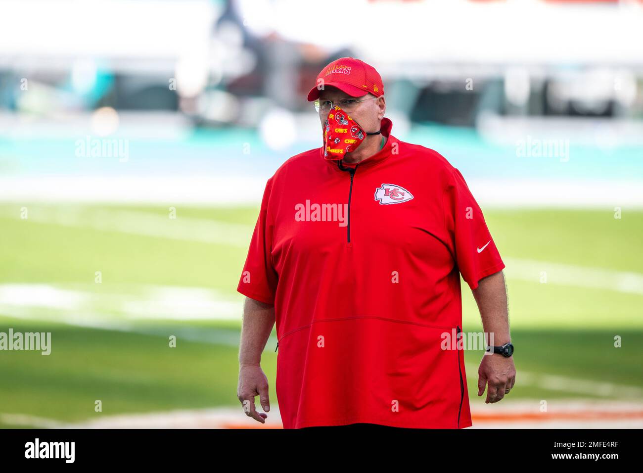 Kansas City Chiefs head coach Andy Reid wears a mask on the field as he ...