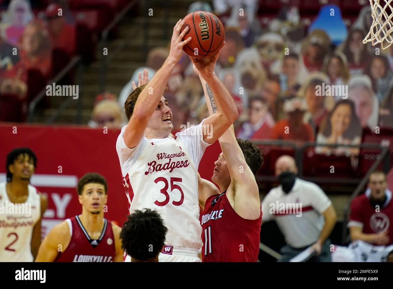 Wisconsin's Nate Reuvers (35) shoots against Louisville's Quinn