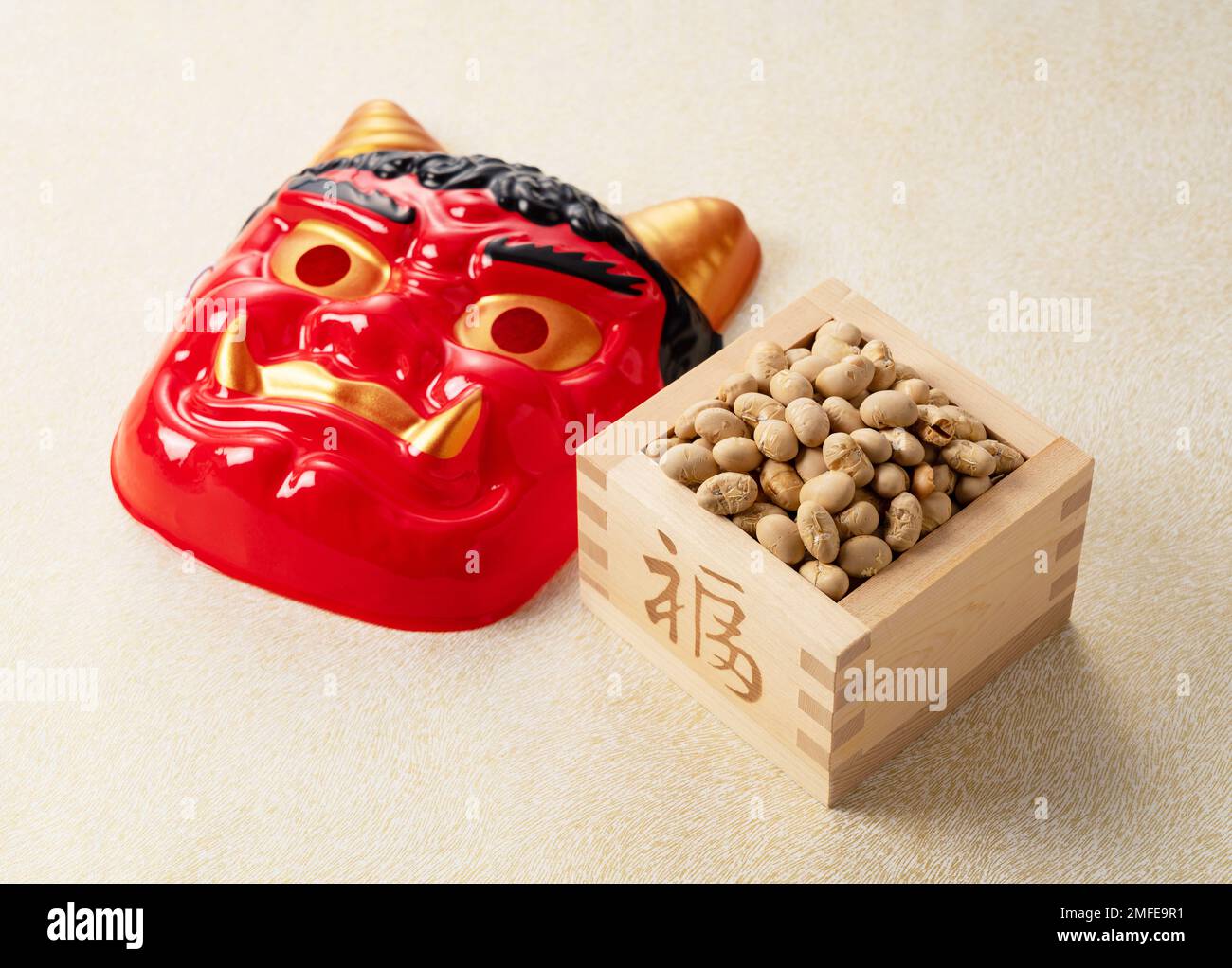 Beans for beanthrowing and masks of ogres placed on a Japanesestyle
