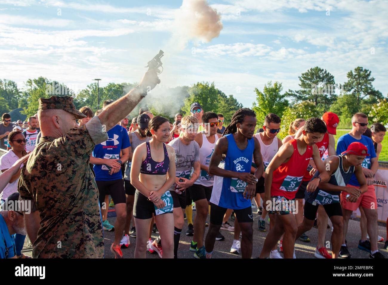 The feelings of anticipation are relieved by the starting gun signaling that the Quantico 12K race has now begun at Marine Corps Base Quantico, Virginia, August 20, 2022. The Quantico 12K is a 7.46 mile journey through the back yard of MCB Quantico's Officer Candidates School before finishing at the OCS PT field. Stock Photo