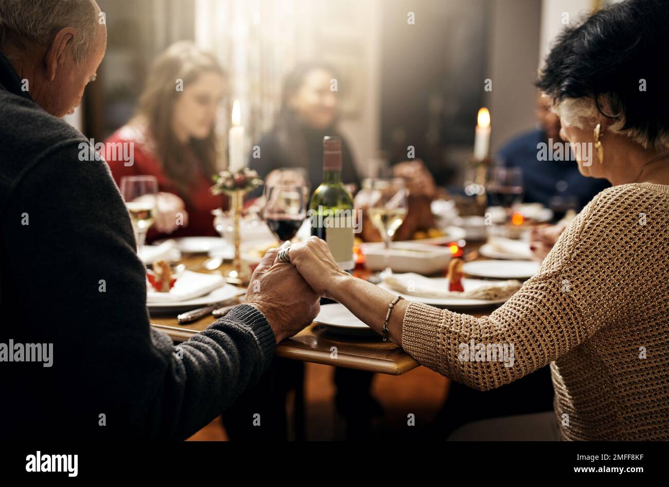 we-thank-you-for-your-blessings-family-holding-hands-in-prayer-before