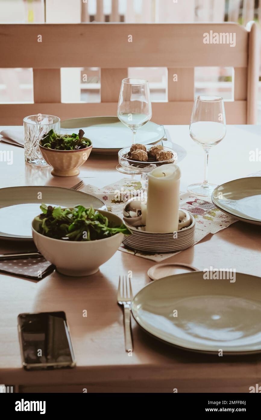 A vertical shot of the modern table set with delicious salads Stock Photo