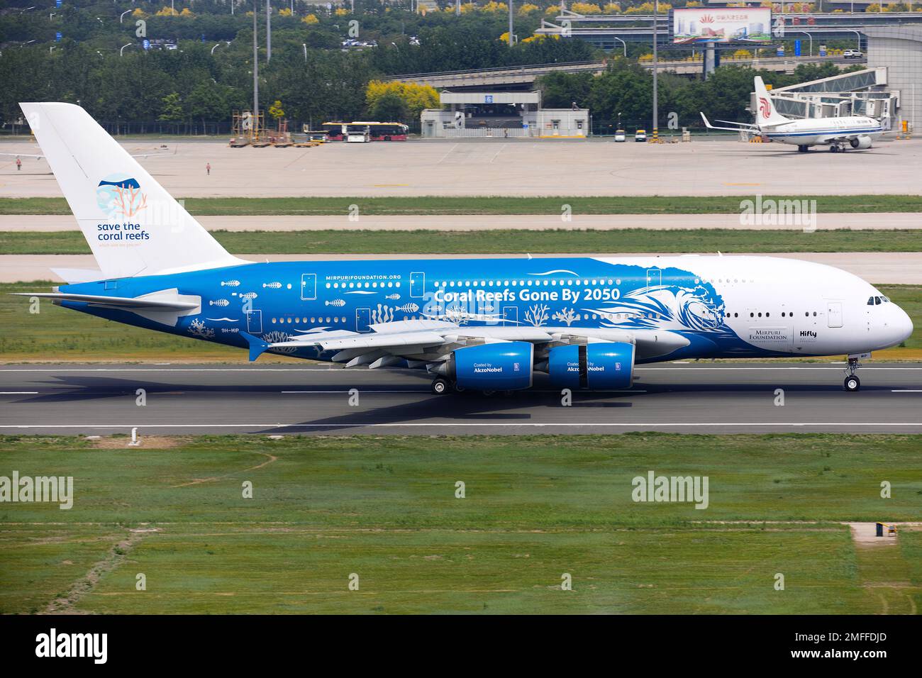 The HiFly Airbus A380-800 landing in Tianjin, China with buildings in the background Stock Photo