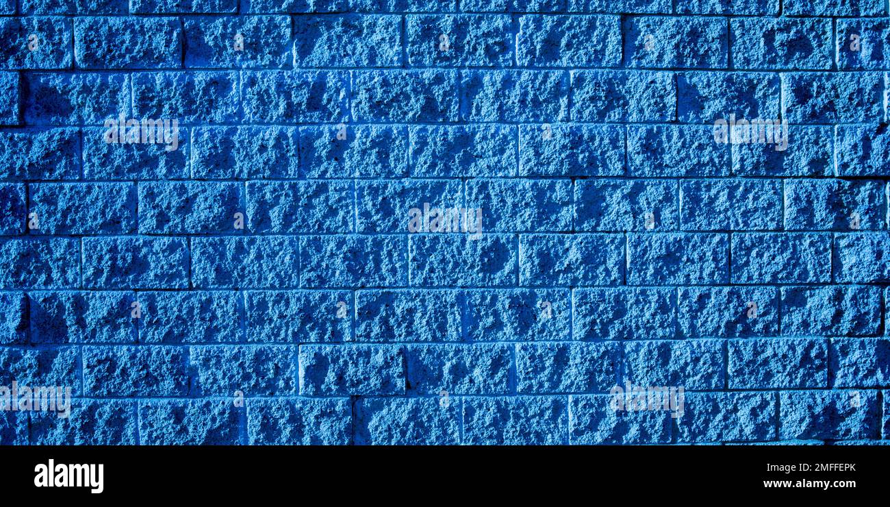 Square blue dark brick block wall background texture paint siding with