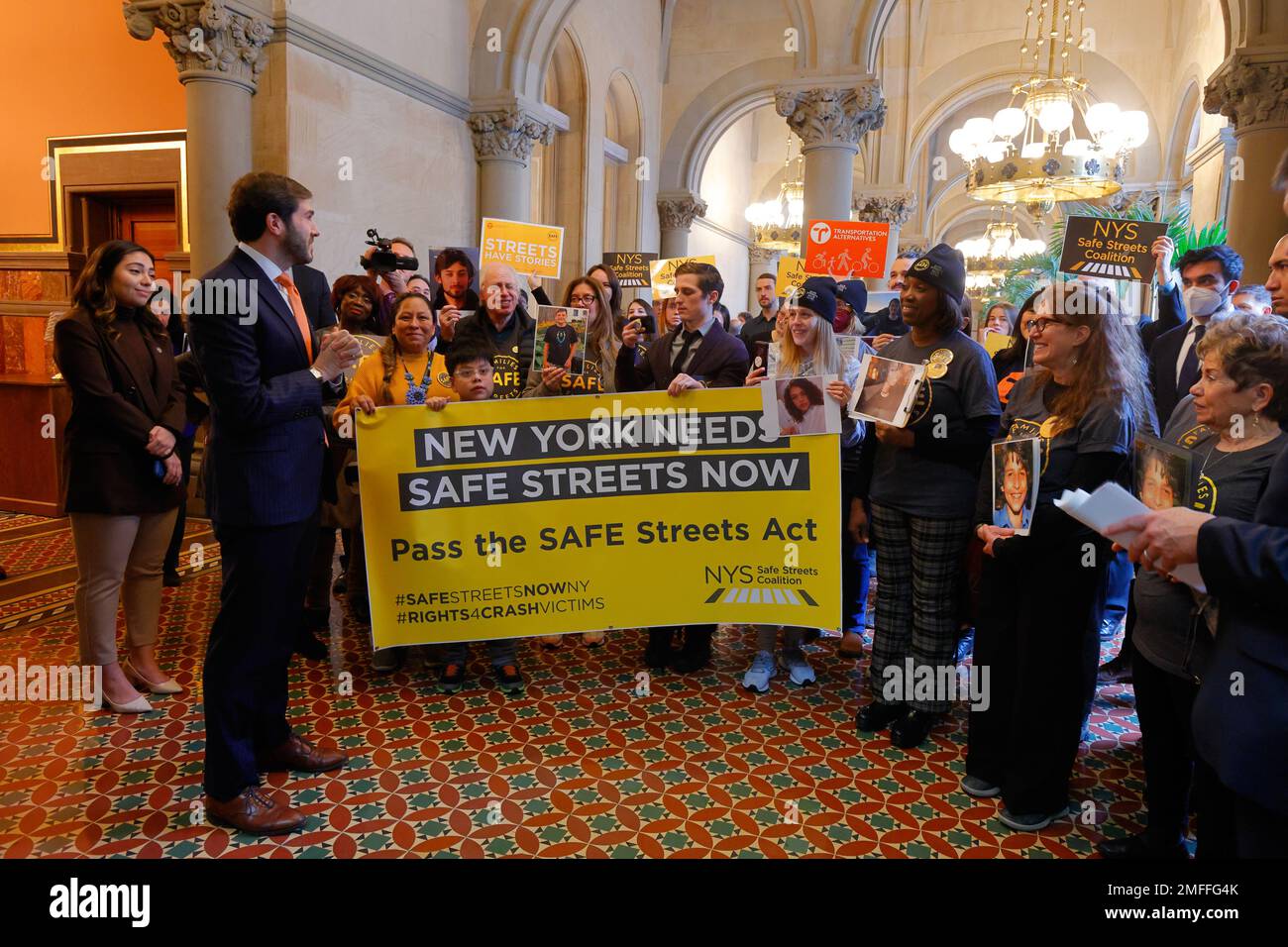 January 24, 2023, Albany, New York. NY Senator Andrew Gounardes (left), and NY Senator Kristen Gonzalez (left) among lawmakers and safe street activists, including Families for Safe Streets, at the New York State Capitol building holding a press conference advocating for the passage of the SAFE Streets Act, a package of bills to redesign streets to be safer for all users. The SAFE Streets Act include Sammy's Law, Complete Streets, and the Crash Victim Bill of Rights. Governor Hochul has signaled support for Sammy's Law allowing NYC to set speed limits below 25mph Stock Photo