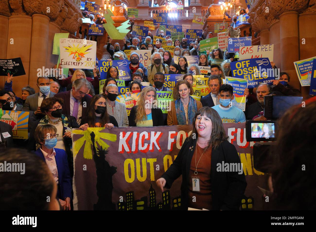 January 24, 2023, Albany, New York. NY Assemblymember Emily Gallagher speaks alongside Renewable Heat Now climate activists and NY state lawmakers, including the environmental conservation committee chairs Glick and Harckham, at a rally and press conference on the steps of the Million Dollar Staircase at the New York State Capitol to call for the passage of the Renewable Heat Act package of bills that include the transition toward all-electric new construction, and an energy efficiency retrofit jobs act. Stock Photo