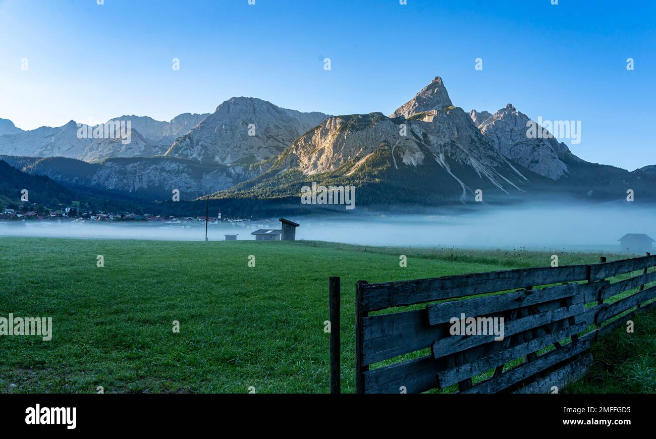 Morning Fog On Wetterstein Mountain, Ehrwald, Tyrol, Austria Stock Photo