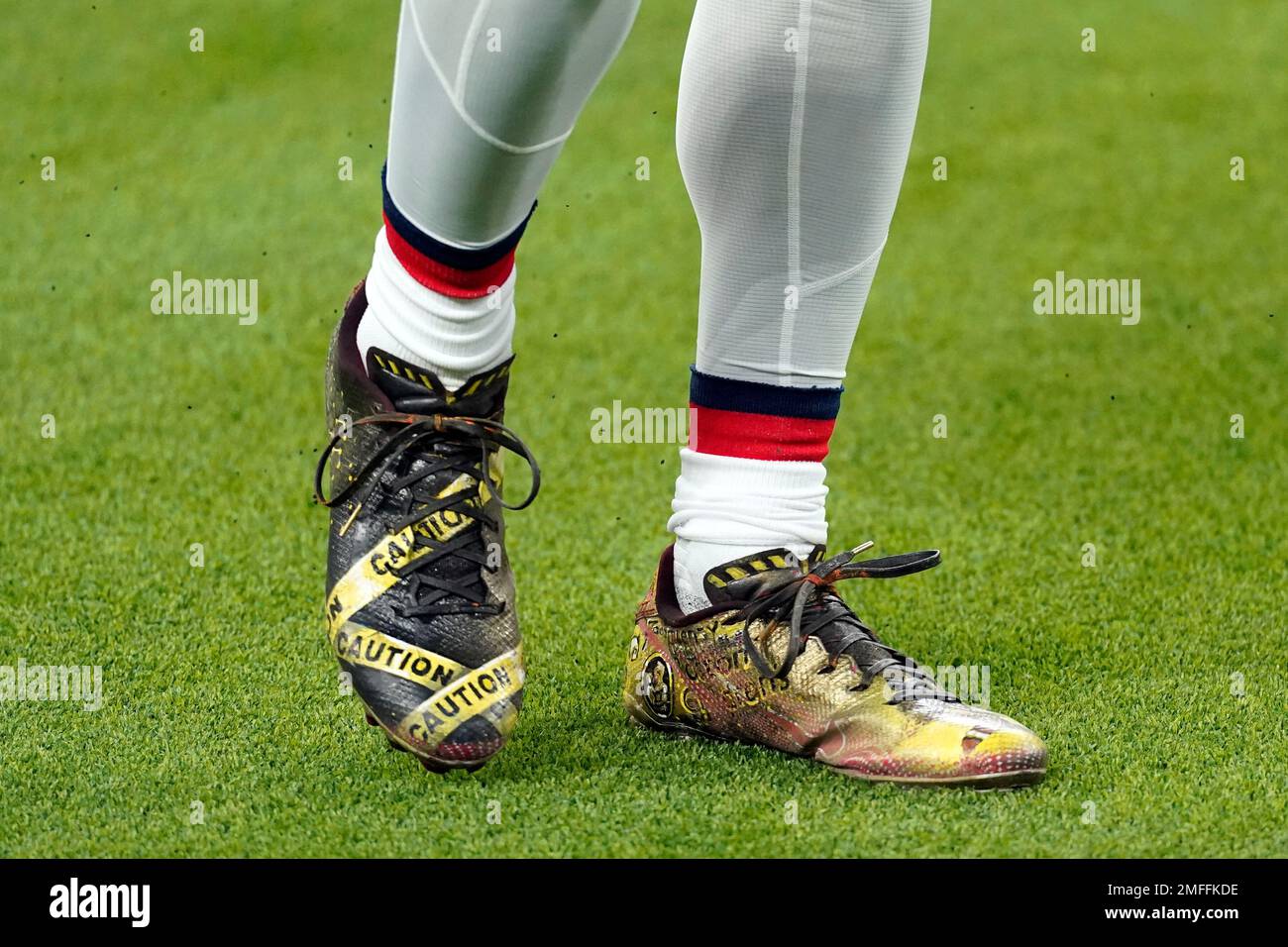 New England Patriots cornerback Jason McCourty wears cleats in honor of
