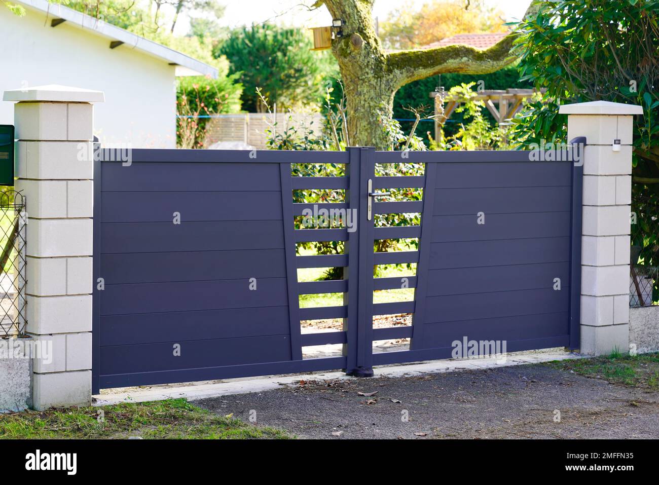 Aluminum modern style home grey gate portal of suburb door house Stock Photo