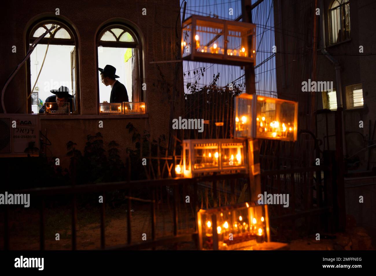 UltraOrthodox Jewish yeshiva students light candles on the first day