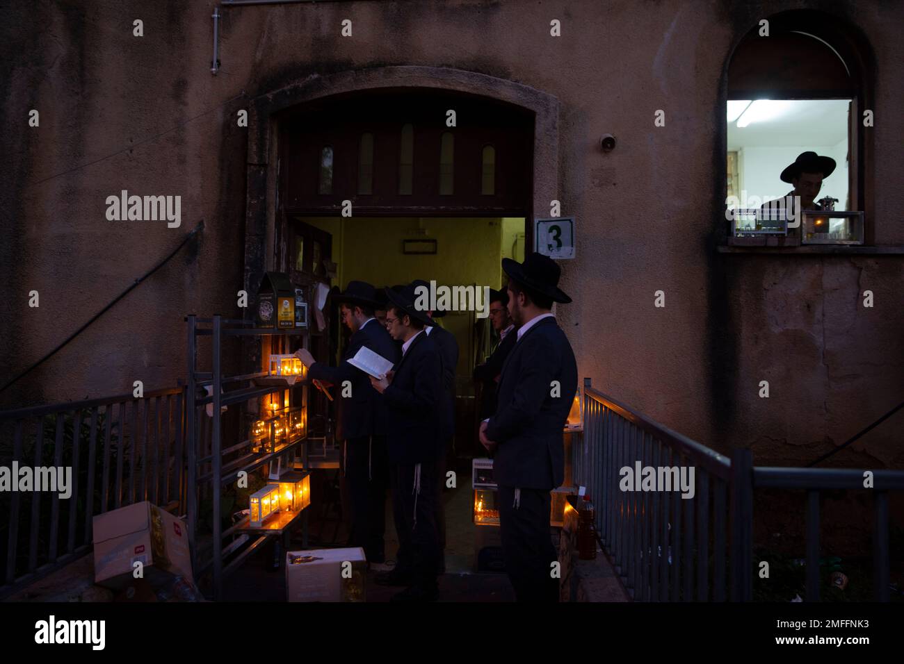UltraOrthodox Jewish yeshiva students light candles on the first day