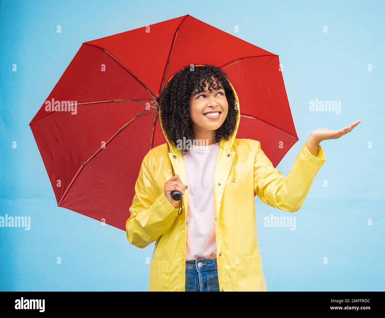 Travel, rain and woman with umbrella in a city, having fun and solo