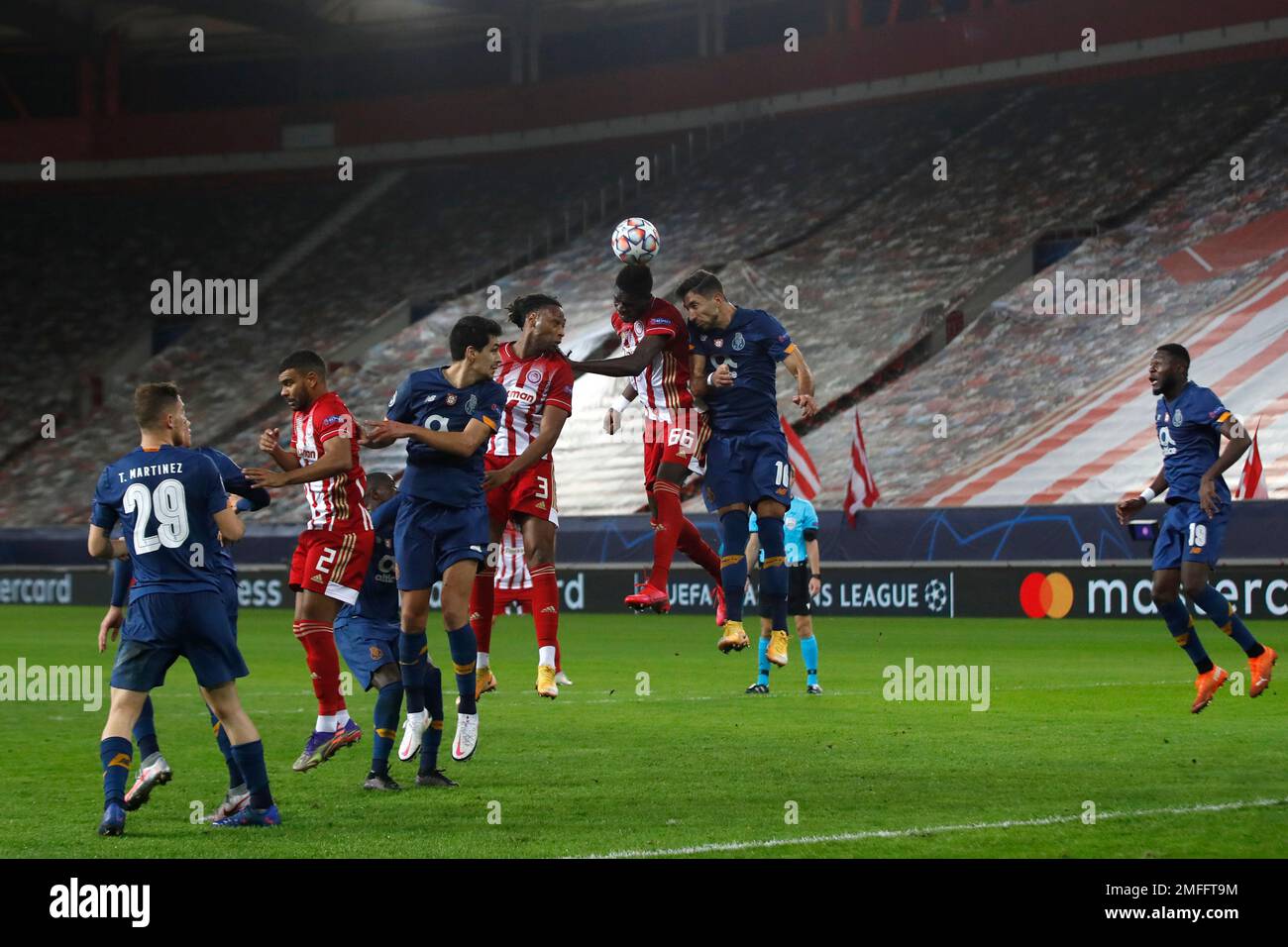 Olympiacos' Pape Abou Cisse, third left, challenges for a header with  Porto's Mateus Uribe during the Champions League, group C soccer match  between Olympiacos and FC Porto at Georgios Karaiskakis stadium in