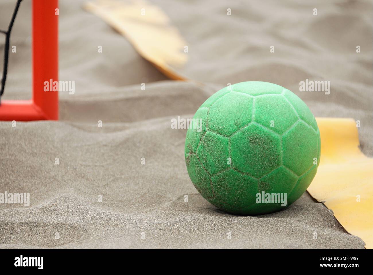 Handball ball on the beach in the sand Stock Photo Alamy