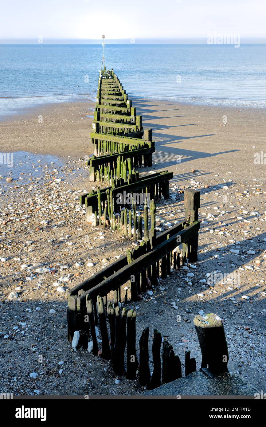 An old weathered zigzag sea defence groyne at Hunstanton Stock Photo