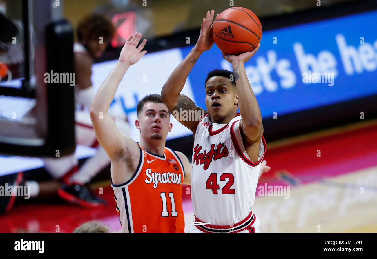 Rutgers guard Jacob Young (42) shoots next to Syracuse guard Joseph