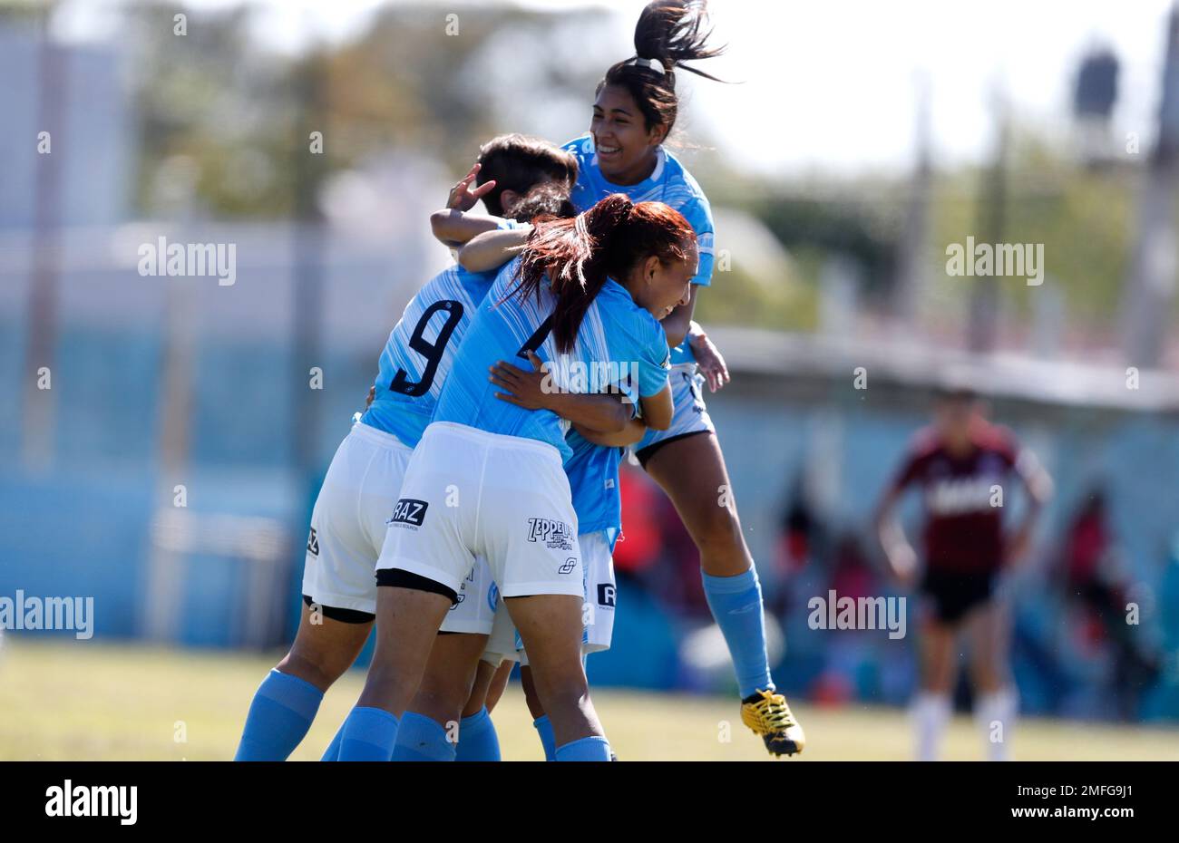 Soccer player Mara Gomez (7), foreground, of Villa San Carlos, celebrates  after teammate Emilia Braga (9) scored her side's opening goal during an  Argentina's professional women's soccer league match against Lanus in