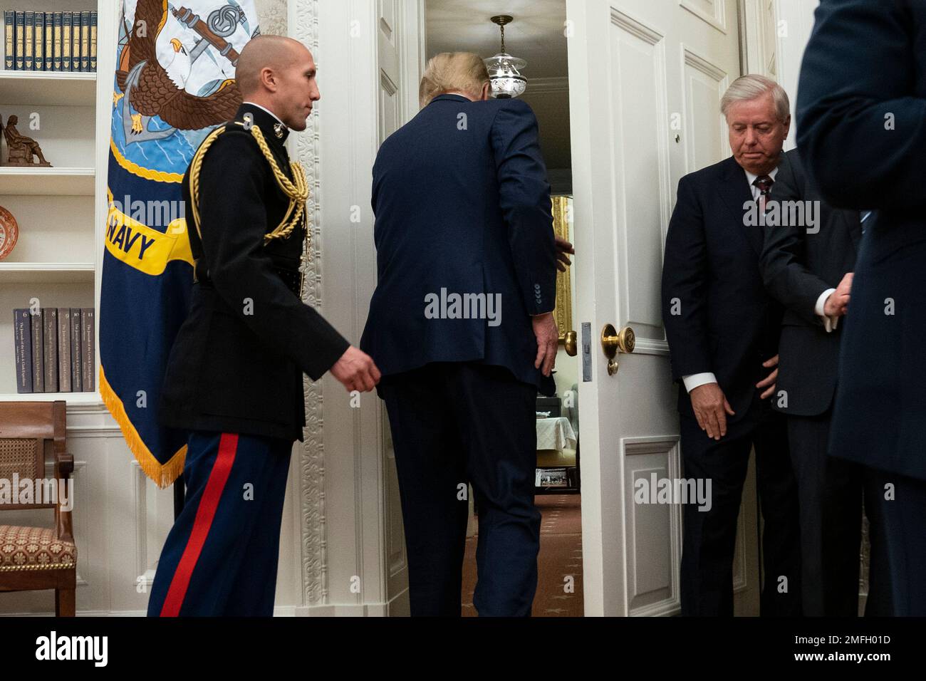 President Donald Trump walks out of the Oval Office after presenting ...