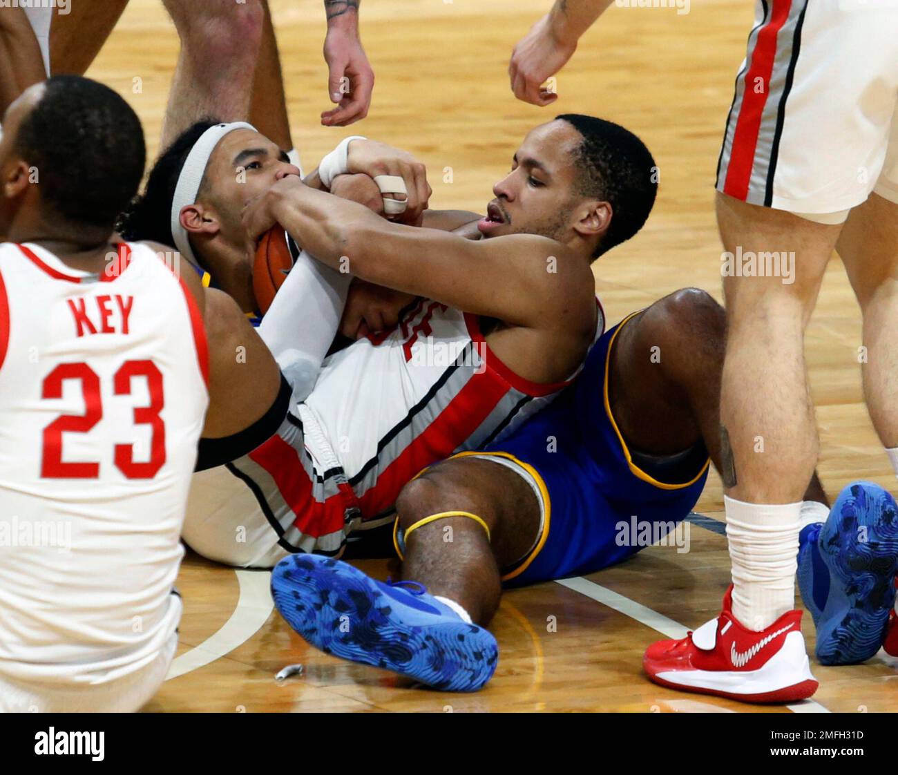 Ohio State guard CJ Walker, right, and Morehead State forward Johni