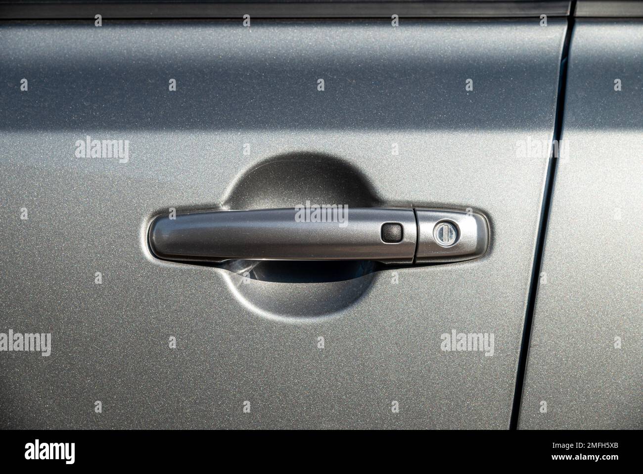 Car door handle with unlock button. keyless entry car door handle with touch sensor Stock Photo
