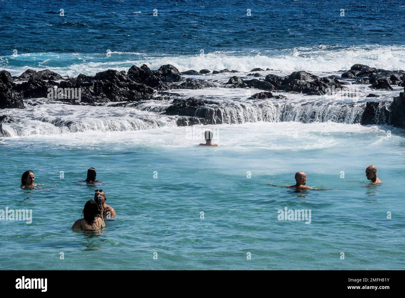 Reunion Island, seaside resort of Boucan Canot people swimming in the