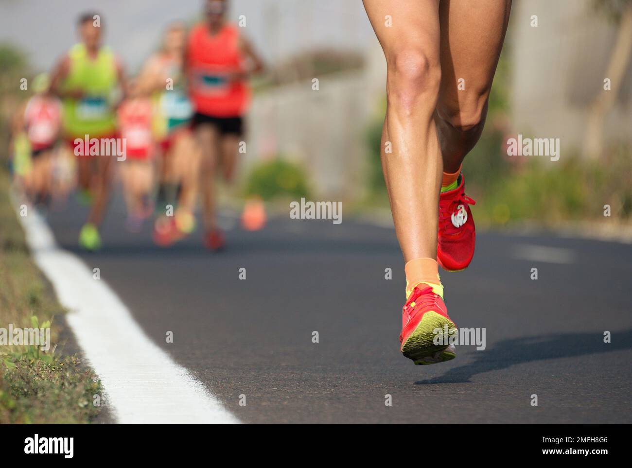 Marathon running race, runners feet on road Stock Photo Alamy