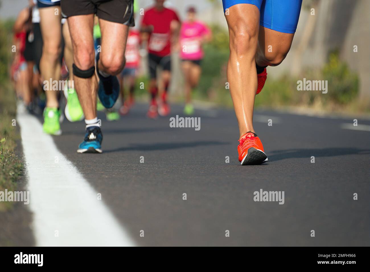 Marathon running race, runners feet on road Stock Photo Alamy