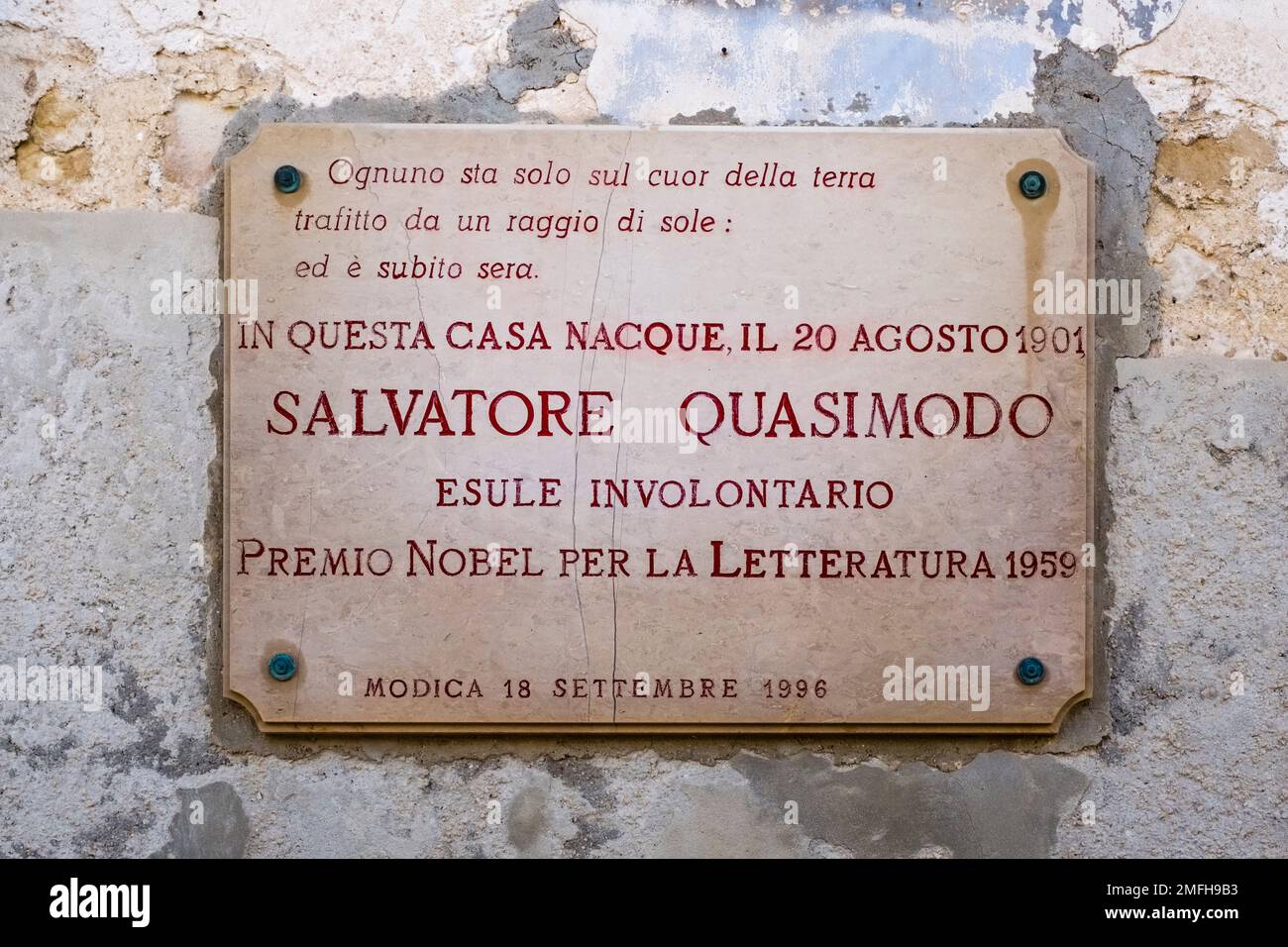 Plaque on the birthplace of Salvatore Quasimodo, an Italian poet and translator, in the Late Baroque town of Modica. Stock Photo