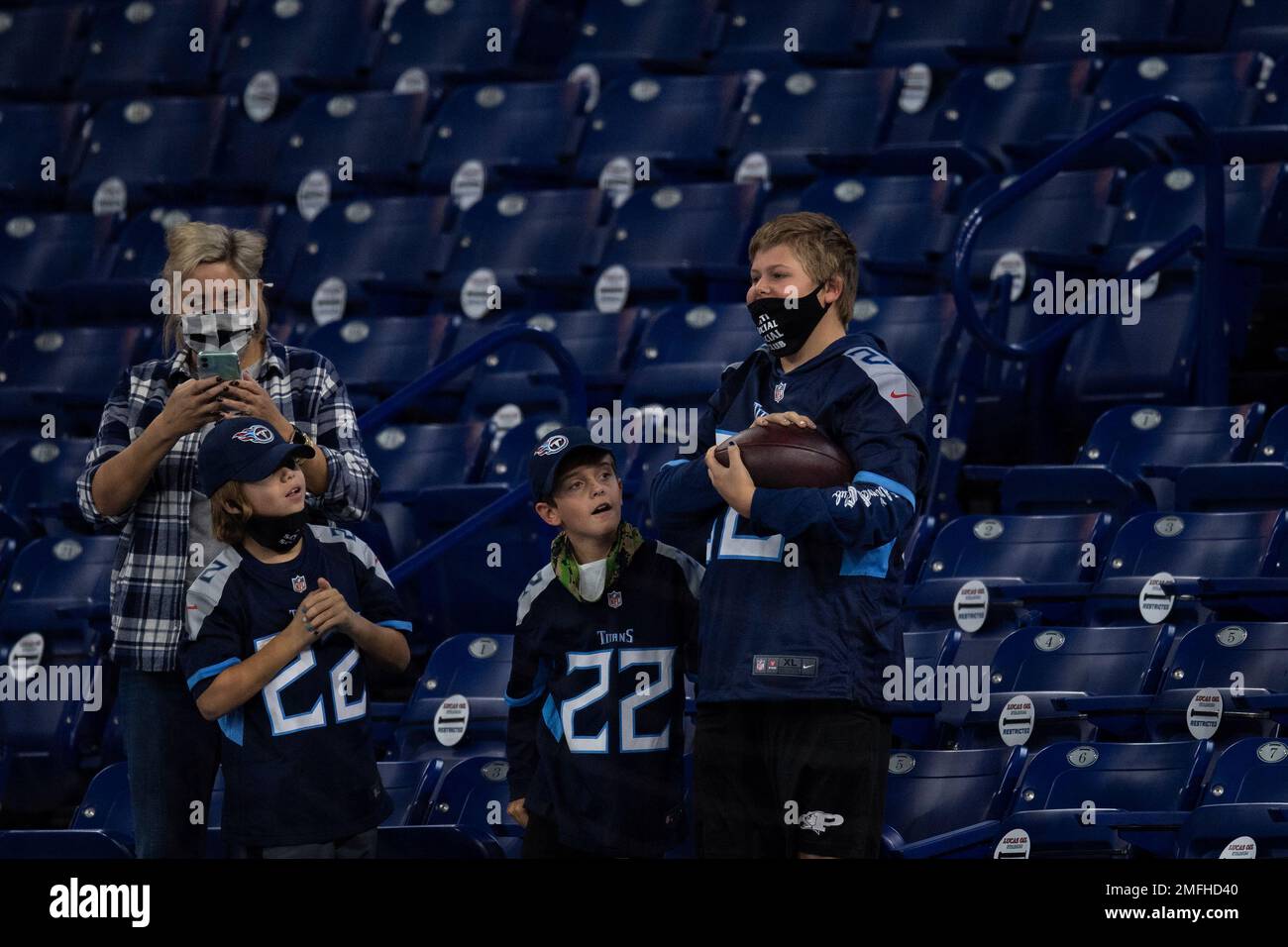 A young Tennessee Titans fan holds his team cheerleader calendar as he  watches an NFL football game between the Philadelphia Eagles and the Tennessee  Titans on Sunday, Oct. 24, 2010, in Nashville