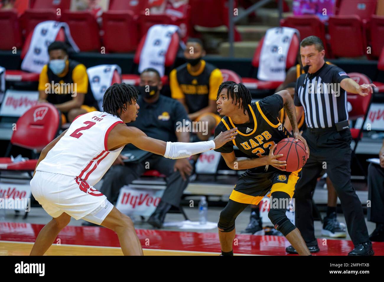ArkansasPine Bluff's Dequan Morris (23) and Wisconsin's Aleem Ford (2
