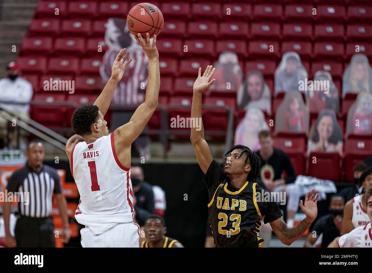 Wisconsin's Jonathan Davis (1) and ArkansasPine Bluff's Dequan Morris