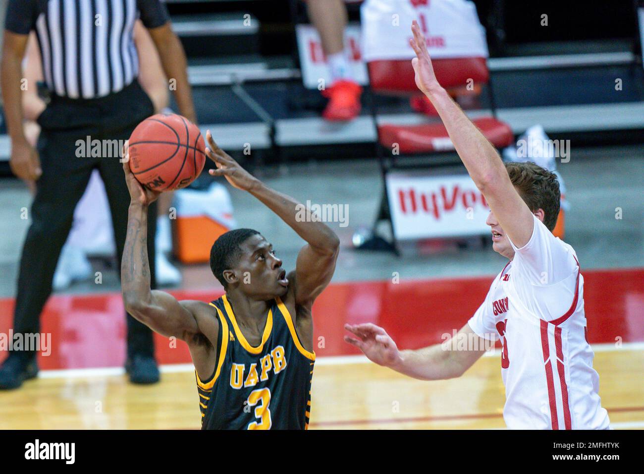 ArkansasPine Bluff's Markedric Bell (3) and Wisconsin's Nate Reuvers